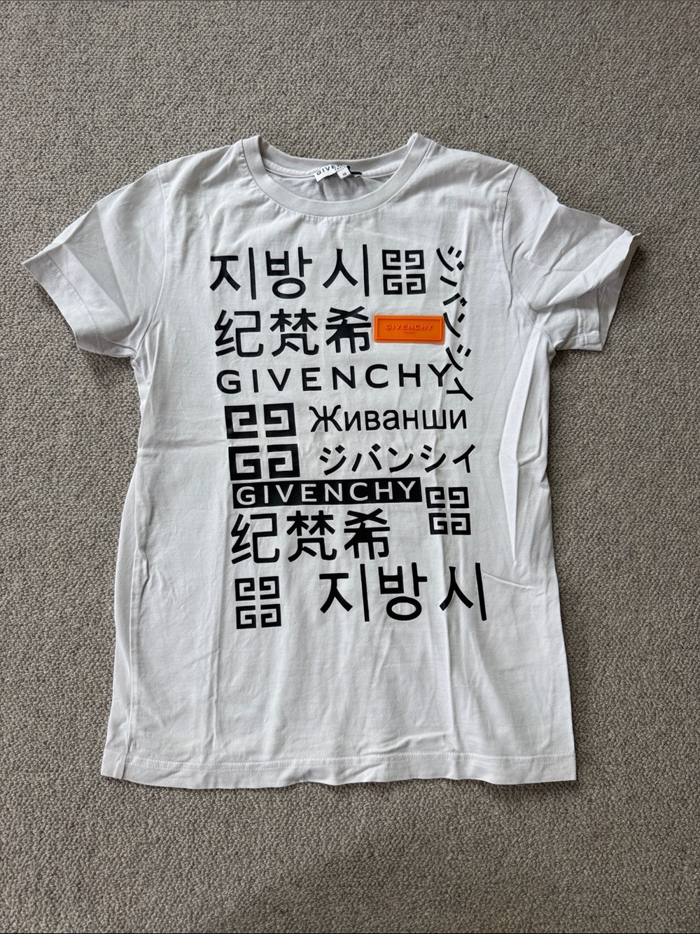 Givenchy White Tee with Black Multilingual Logo and Orange Patch